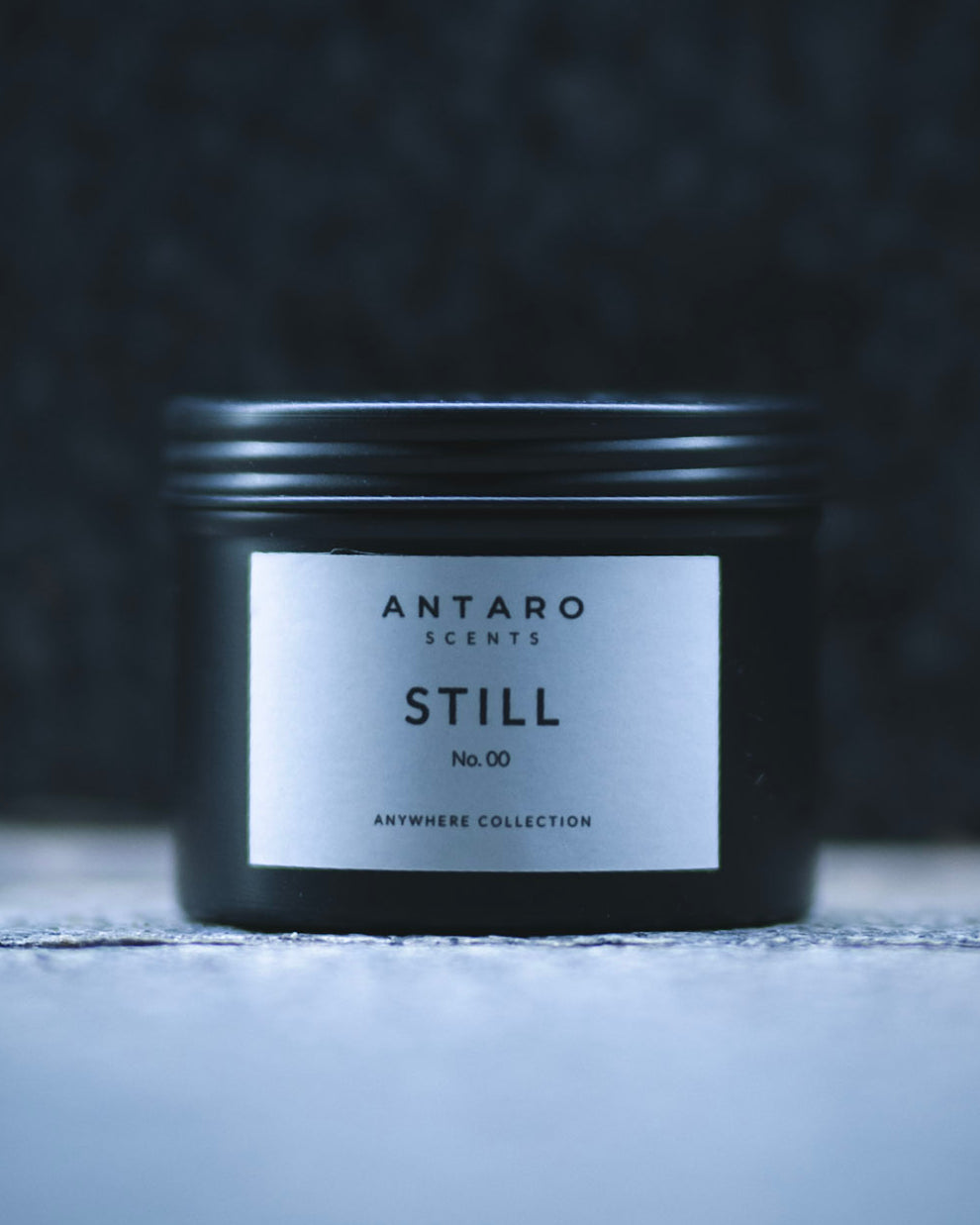 STILL No.00 travel candle in a matte black tin