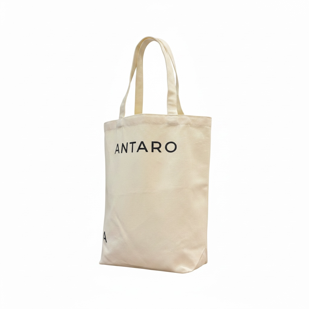An off-white canvas tote bag with black printed text reading 'ANTARO' on the front, displayed against a solid white background.