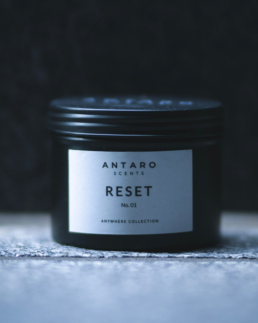 RESET No.01 travel candle in a matte black tin